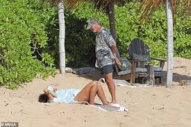 The actor posted a celebratory selfie of him and wife keely shaye smith in front of some of his paintings to. Pierce Brosnan Relaxes On The Beach With His Wife Keely Shaye Smith Near Their Hawaii Home Readsector