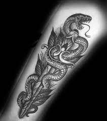 Extraordinary snake dagger blackwork tattoo. 50 Snake Dagger Tattoo Ideas For Men Sharp Serpent Designs