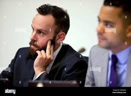 Tom Temprano (left), board vice president, and Alex Randolph, board  president, listen to a speaker during the Board of Trustees meeting in  Conlan Hall at City College San Francisco in San Francisco,