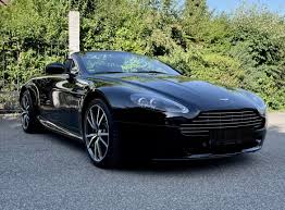 Image result for Midnight Blue 2011 Aston Martin