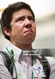 Eli Godwin, of Medford, Mass., breaks down in tears after Governor... News  Photo