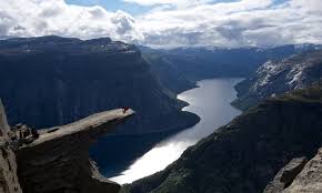 Hiking trolltunga and sitting on the edge of. Trolltunga Hike