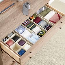 The expandable dresser drawer divider is a perfect tool for organization and clutter free storage. Linen Cambridge Drawer Organizers The Container Store