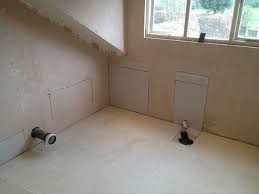 I think the typical way of laying a floor down is to add a foam or cork underlayment and proceed with the installation. Tiling On Wooden Floors Part 4 Overboarding Uk Bathroom Guru