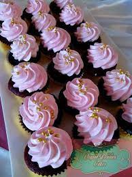 Pin By Joan Tavarro On Oopsie Daisies Cupcakes Gold Cupcakes Baby Shower Dessert Table First Birthday Cupcakes