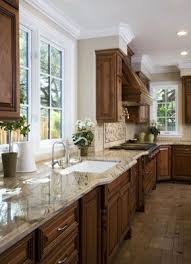 Dark Cabinets Light Counter Tops Medium Floor With Champaign Walls And White Windows 3 Brown Kitchen Cabinets Kitchen Renovation Kitchen Remodel