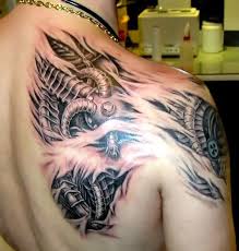 Biomechanical Shoulder Blade Tattoo Idea Biomechanical Tattoo Ripped Skin Tattoo Shoulder Blade Tattoo