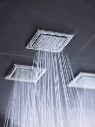 Offering A New Showering Aesthetic The Kohler Watertile Bodyspray Features An Innovative Tile Design That Mo Bathroom Decor Modern Shower Design Shower Panels
