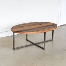 Our Oval Reclaimed Wood Coffee Table Blends Industrial Criss Cross Legs With A Smooth Modern Ov Reclaimed Coffee Table Coffee Table Reclaimed Wood Coffee Table