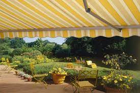 Retractable Folding Lateral Arm Canvas Striped Awning In A German Garden Patio Deck With Pergola Covered Pergola