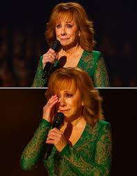 Movie - 80,000 people watching… Reba McEntire took the stage and sang  “Consider Me Gone.” But what no one expected was how emotional it would  get. When her voice cracked and she