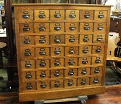 A filing cabinet (or sometimes file cabinet in american english) is a piece of office furniture usually used to store paper documents in file folders. Old Library Card Catalog By Adriana Card Catalog Cabinet Library Card Catalog Library Card Catalog Cabinet