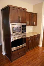 Dark Stained Poplar Cabinets Maybe Stain My Cabinets Like This And Have New Doors Made Stained Kitchen Cabinets Wood Kitchen Cabinets Kitchen Redo