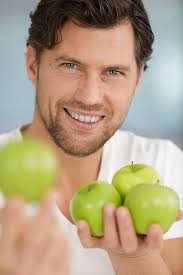 Man Holding A Green Apples Photo Background And Picture For Free Download