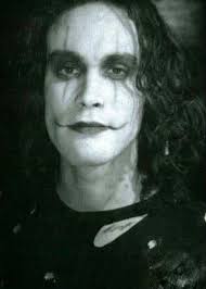 In The Crow just before Eric paints his face, he is sitting at the dresser  looking at memories of his life with Shelly, he pulls some pictures out of  a drawer and