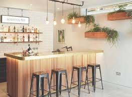 To help you get started, we'll show you 15 creative home bar ideas for the ultimate indulgence. This Quirky Industrial Style Home Bar In London Comes Complete With High Stools A Lit Up Modern Home Bar Bar Interior Design Home Bar Design