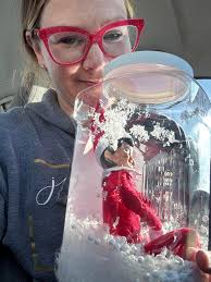 Small town police officer brings lost elf home