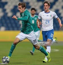 Arminia's head coach uwe neuhaus walks on the pitch prior to the start of the german bundesliga soccer match between borussia dortmund and arminia bielefeld in dortmund, germany, saturday, feb. Florian Neuhaus Of Germany Is Challenged By Nicolo Zaniolo Of Italy Challenges Germany Italy