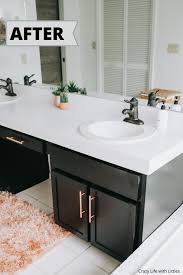 Make a dated bathroom vanity look new again with a paint job and some elbow grease. Painting Laminate Cabinets And Countertop Under 100 Crazy Life With Littles Diy Home Decor