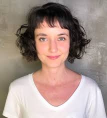 Whether your hair is long hair with fringe or short, we've covered every style from sweeping to full a fringe cut into curly hair can be challenging but ella demonstrates that rolling with it is the only approach. 50 Best Haircuts And Hairstyles For Short Curly Hair In 2021 Hair Adviser