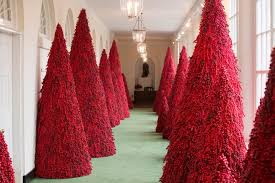 The first lady just revealed this year's white house holiday decorations, which feature a decidedly red color palette. Donald Trump Melania Hold Hands In Official Christmas Portrait
