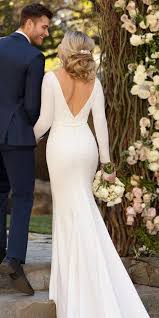 It's traditional, but has a low cut and a tie at the back of the neck give it a bit of extra personality. 27 Of The Most Graceful Simple Wedding Dresses With Sleeves Wedding Dresses Guide