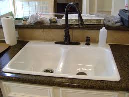 white cabinets white sink bronze