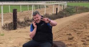 .trainer gordon elliott has vowed to help with the investigation into a photograph spread on social media appearing to show him sat on top of a dead horse. Ntqvebck8 Z4bm
