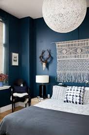 The room offers a brown leather sofa set and a fireplace along with a tv on top of it. Interiors To Inspire Dark Bohemian Coco Kelley Blue Bedroom Decor Blue Bedroom Walls Bedroom Decor Cozy
