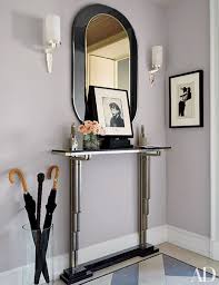 A galleried tray table makes an excellent wall mirror. 25 Ways To Decorate A Console Table Architectural Digest