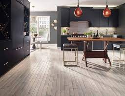 Typically Moody Kitchens Have Dark Cabinets And Dark Flooring But That Doesn T Mean White Washe Vinyl Flooring Kitchen Solid Hardwood Floors Kitchen Flooring
