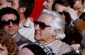 Hector Crawford at the 1979 VFL grand final. Photo courtesy of the National  Archives of Australia. Hector was a passionate supporter of the Collingwood  FC. https://en.m.wikipedia.org/wiki/Hector_Crawford