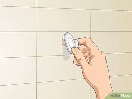 For anything but an occasional cracked or broken tile, hire a roofer. 3 Ways To Cover Holes In Ceramic Wall Tiles Wikihow