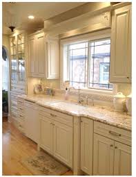 Definitely Want To Eventually Paint The Kitchen Cabinets White And Do A Faux Countertop To Look Kitchen Renovation Cream Kitchen Cabinets New Kitchen Cabinets