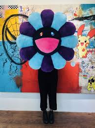 His iconic flower character has been seen in galleries and homes all over the world, and this 60cm rainbow flower plush is an affordable way to own a piece from the masterful japanese artist. Takashi Murakami Flower Cushion Blue Purple X Navy 2019 Artsy