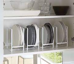 Kitchen storage cabinets for optimally supports three work areas. Store More Plates On A Shelf That Is Too Wide And Not Tall Enough You Ve Got To Make The Most Of Small Kitchen Storage Tidy Kitchen Kitchen Storage Solutions