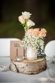 The wedding flower centerpieces, bouquets, and arrangements are out of this world gorgeous, take a look at these 48. Flower And Table Number On Wood Slab Wood Slice Centerpiece Wedding Wood Slab Centerpiece Wedding Wood Slab Centerpiece