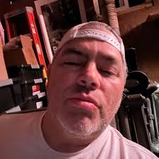 Anyone know who this strange shirtless man is? My camera caught him lurking  between my car and my door at about 12:45am last night. Luckily I keep  everything locked up so nothing