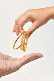 Maybe you would like to learn more about one of these? Female Hand Giving The Gold Bracelet To Others Stock Photo Picture And Royalty Free Image Image 21558663