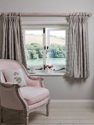 With Small Cottage Windows Shorter Curtains Emphasis The Shape Of The Window And Allow More Light Into Th Cottage Curtains Curtains Living Room Short Curtains