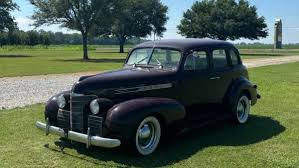 Image result for Trojan Maroon 1939 Oldsmobile