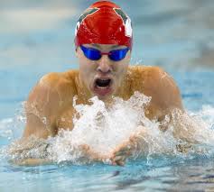 SWIMMING: The Woodlands triumphs at regional meet; Hinze makes Conroe  history