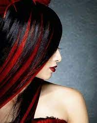 This hairstyle gives people a way to add black to their hair without completely dying their hair black. Black Hair Red Streaks Men