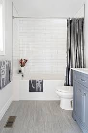 Blue Grey Bathroom Vanity With White Subway Tiles And Whimsical Accessories Grey Bathroom Vanity Grey Blue Bathroom Tile Bathroom