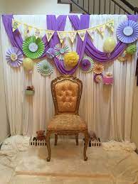 Backdrop Where The Mom To Be Sits All The Guests Put Bangles For Her One By One Indi Indian Baby Shower Decorations Baby Shower Decorations Baby Shower Deco