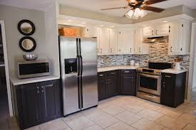 Alabaster sw 7008 in chip & joanna gaines' kitchen from the harper home another area (besides the kitchen) that can benefit from alabaster , is the bedroom. Photo Credit Lacy Tomlinson Upper Cabinet Color Sw Alabaster Lower Cabinet Color Sw Sealskin Upper Cabinets Cabinet Colors Two Tone Kitchen