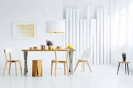 Our top pick, the hercules premium series resin chair from flash furniture can support 1000 pounds! Spacious White Dining Room Interior With Big Table Chairs And Tubes Wall Stock Photo Picture And Royalty Free Image Image 98295239