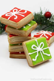 Sugar cookies topped in mmf with royal icing decorations. Step By Step Decorating Instructions To Make Christmas Present Cookies