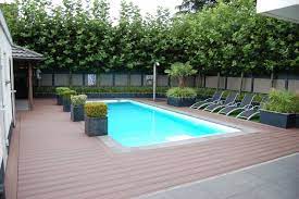 Pro tips for planning a deck to go around a pool or a spa by genevieve schmidt. Pool Deck With Fiberon Composite Decking Contemporary Swimming Pool Charlotte By Fiberon Decking Houzz