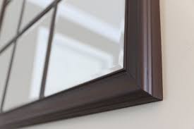 Recently i was searching the web for some wall decor for our new place once we make our big move. Build A Beautiful Window Pane Mirror